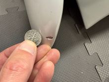 Chip on top of wing-end (passenger side), dime for scale
