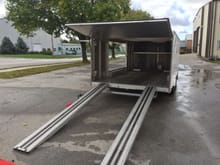 Swing up rear door and long pull out ramps which store under the trailer easily