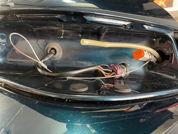 I would have prefered the larger connector on the center lens side but it interfered with the opening for the lens.

I decided not to cut the cars harness and spliced into the tail light assembly. It requires an additional plug to be unplugged when removing the tail light but preserved the harness.  