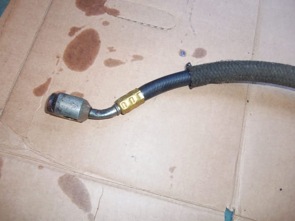 Banjo fluid fitting for driver's side of the transmission, with new hose and crimp ferrule.
