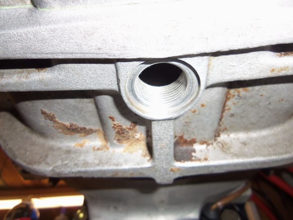 S4 style drain hole at the bottom of the differential. Because the routing of the exhaust blocks access to the traditional drain hole at the bottom of the differential cover.