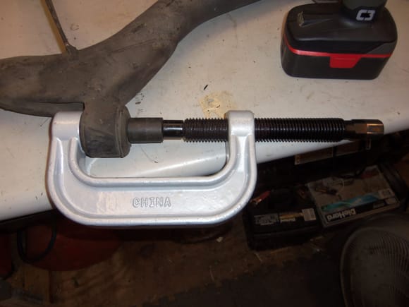Pressing the sleeve out of a bushing on a 1988 lower control arm.
