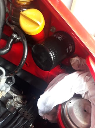 New oil filter installed, smear of oil around seal and tightened hand tight plus a slight turn with oil filter wrench.
