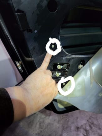 19.1 These 2 screws to remove a plastic cover in the cavity of the door.  Without removing this plastic, there is no space to put a tool to remove the handle.