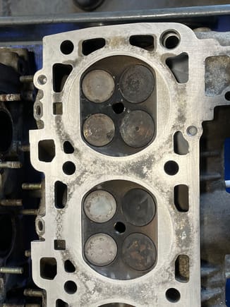 87 head with 38,000 miles. Percolating in "green" coolant for several years, without engine run. One minor pit in surface of entire head, seen on the upper right side.