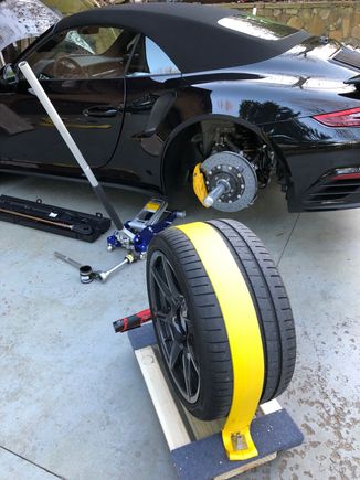 Now the wheel is strapped to the dolly and can be moved about.  Don't let the dolly roll down the hill.