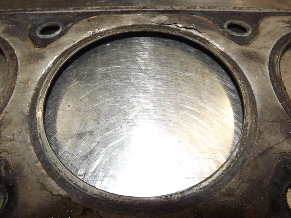 4.7 gasket, from the "cylinder side". Easy to see how much of this gasket "hangs over" into the coolant. Note the change in color between the "captive" portion of the gasket and the "exposed" portion.