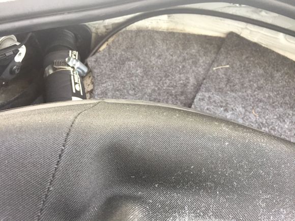 This is where the intake comes into the cabin and is routed along the firewall to a hole just beneath/ next to rear seat.