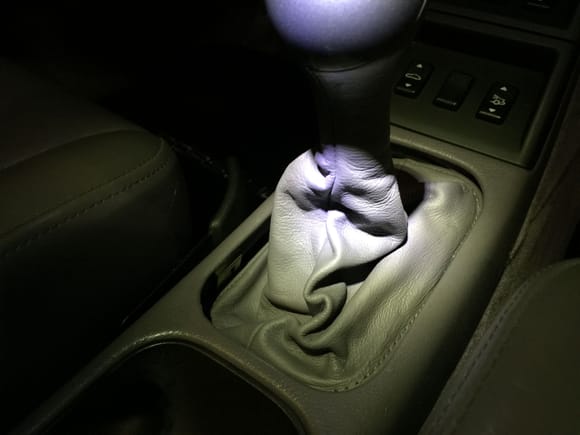Drop the glove back in one corner at a time like a window screen, press right side up into the groove and then gently pull the left side of the boot up until it secures against the fasteners. Too easy.