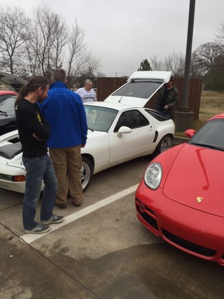 Simon, Brian, and Roger are checking out Darien's "Louie" car