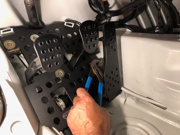 Hold cable steady with a wrench, and snap the throttle pedal back on and you're done