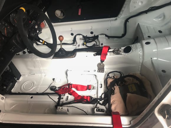 The Brey Krause 9005 provides a nice solution for the tunnel belt, and the GT3 lap belts bolt right onto the BK mount and a bolt in the door sill bung