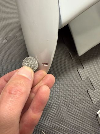 Chip on top of wing-end (passenger side), dime for scale