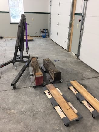 My millwright equipment, ready. Wheel dollies, plus four $10.99 furniture dollies from Harbor Freight. Camp 928 attendees might notice that I've re-purposed two campfire benches. 
