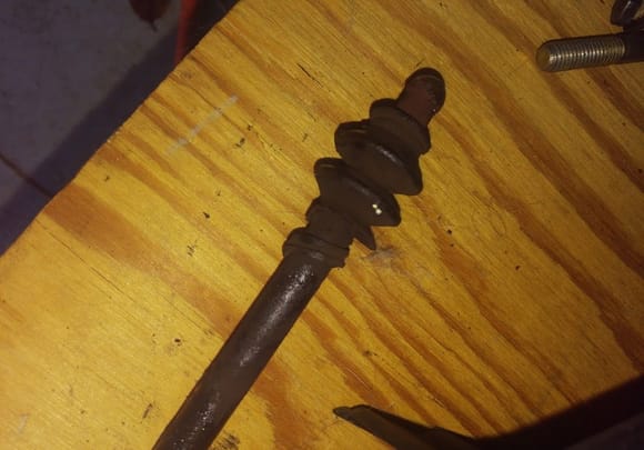 Found this on the slave cylinder rod when I put the flywheel lock on. That boot (?) looks torn. I've had zero problems with clutch action, gear shifts, etc...but is this something I can fix easily?  Do I need to? Transmissions and their inner workings are still in the realm of magic to me...