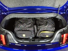 Two 23 inch burton wheeled duffels in trunk with room to spare. These duffels are huge!