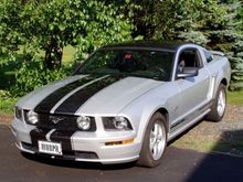 New painted front stripes. Hard to tell the color, but a charcoal gray with a slight metallic fleck.