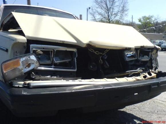 1988 240 DL: that chain was there BEFORE this accident. This was about the third time the hood had been &quot;tented&quot;!