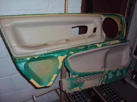 The Inner panel. This is a panel I bought because it has a leather armrest insert. The one in my car is vinyl and separating. My plan is to remove the one from my car, separate it into two pieces, and combine my outer panel with the leather inner panel I bought. I'm doing this because the outer panel from the one I bought has major gouges in it, and the one in my car is quite clean.