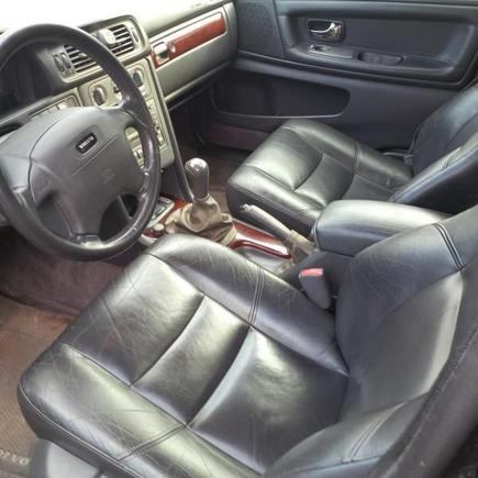 1/14/14 
Aftershot of interior. Replaced both front seats, steering wheel, all 4 door panels, added wood trim to console and glove box. Added Volvo winter mats.