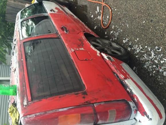 Stripping white paint off.