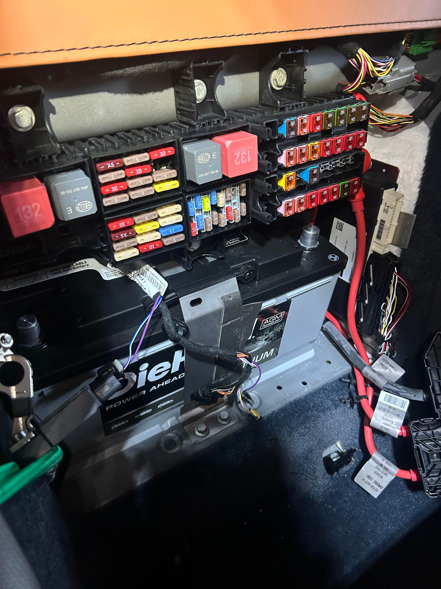 New battery in, fuse panel secure. Reconnect electrical components.