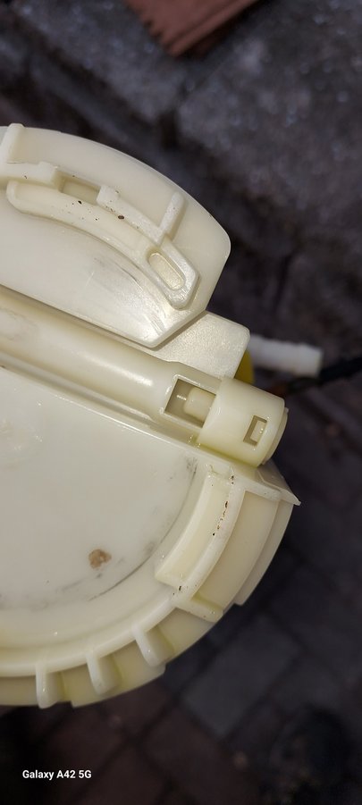 bottom of fuel pump assembly - small square hole is the fuel inlet.