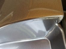 Existing damage shown with the trunk hatch open.