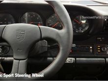 Classic steering wheel with embossed emblem and PORSCHE logo.  Available with red or black stitching.