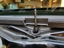 Pull the metal pin down from the shade with the door panel still on the car.

then remove both the plastic tube and pin or drive bar by pulling up.
some clamps with plastic pads will help with the leverage and marring.