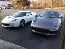 My '11 Evora next to my buddy's '15 911 in manual.  Both cars feel about the same in useable power, but a different sensation driving them both