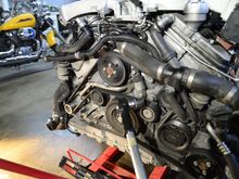 Changing the serpentine belt is easy, when the engine is out. Notice, you need a BFW (Big Fk*n Wrench) to turn the tensioner.....