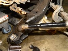 Remove the outer spring clip (the thicker clip), then the rest the CV boot. Clean everything thoroughly afterwards.