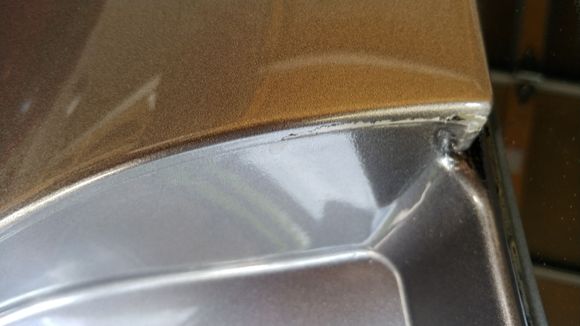 Existing damage shown with the trunk hatch open.