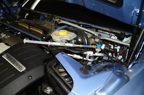 After everything is put together, it is time to recharge the AC system. First, inject just 1 oz or so AC compressor oil. When removing the AC radiator, you only lose the oil in the lines and not much more. The rest of the compressor oil is still inside the AC compressor.