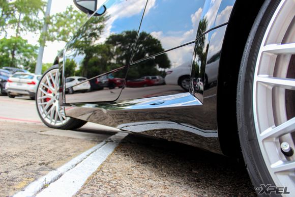 The rocker panels are completely wrapped with XPEL ULTIMATE to help prevent rock chips and road debris from damaging the painted surface