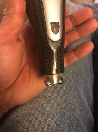 Here you can see the notorious split in the resin that oem carbon fiber gets on the lower segment. Cannot notice it when installed. 