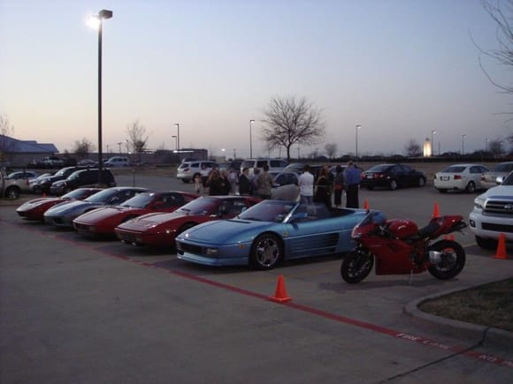 Ferrari Dinner Picture. Notice the car that everyone is crowded around. ( SMART car )