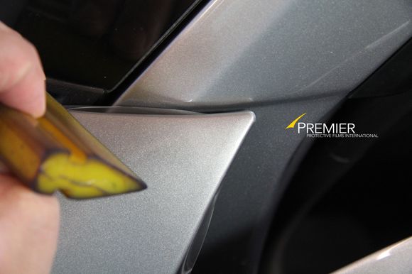 Pre-cut kits will have notches and seams at the corners.  Others who attempt custom installations often leave film bunched up and lifting in these areas.