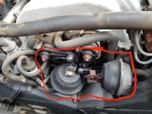 It is the two parts circled in red, they are rusty and the links are broken