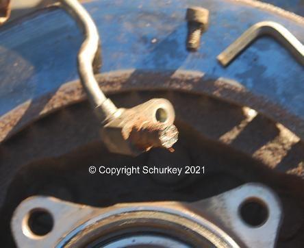 K2500 wheel-speed sensor removed from hub.  Small Allen-head bolt and 7mm Allen wrench pictured also.