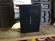 A picture of the subwoofer from the front with the aluminum supports attached.