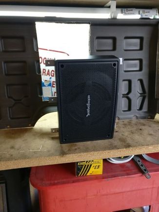 A picture of the subwoofer from the front with the aluminum supports attached.
