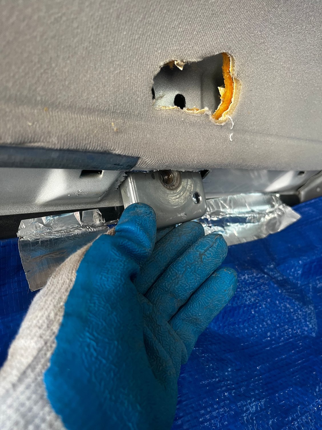 Line your rear with a tarp to catch shavings. 