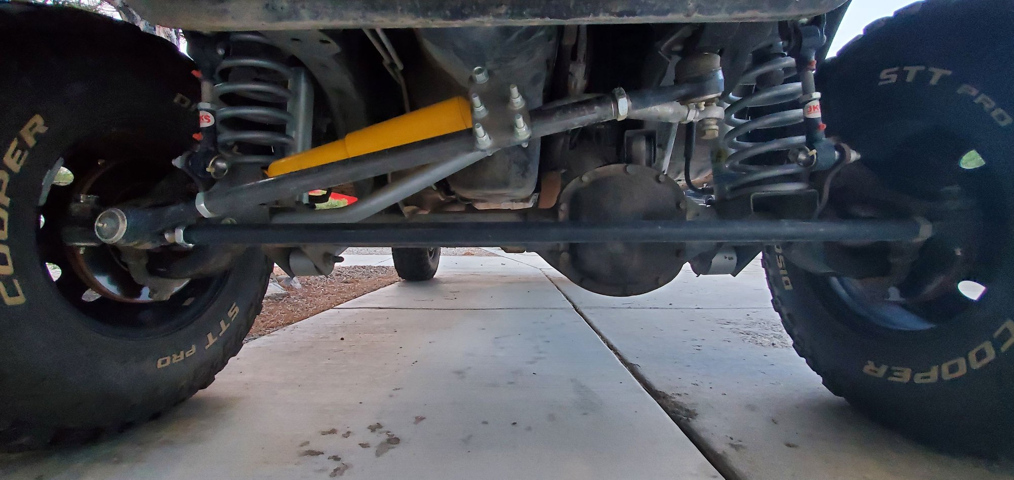 Steering stabilizer rubs/knocks on track bar Jeep Cherokee Forum