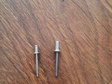 This is the size comparison to what the factory rivets were, and the size i drilled the parts out to. 