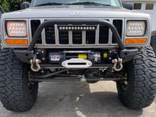 Reilly used Ares Fabs modular bumper ends on his installation. These will bolt right onto the stock bumper mounts and there are several styles available.
https://aresfabrication.com/model/xj/bumpers-xj/
