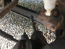 By removing the two 1/2" bolts.