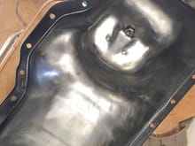 I sand blasted the in and out of the oil pan, then took a wire brush to the inside to smooth it out afterwards. Then black engine paint on the outside.