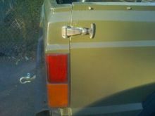 when i got it with a bungee holding the hatch closed. i added the rubber style hood hold down.